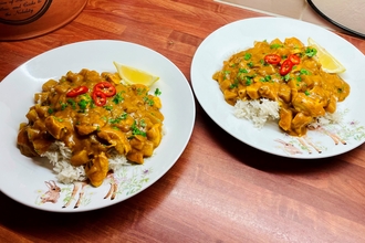 Two plates of turkey curry