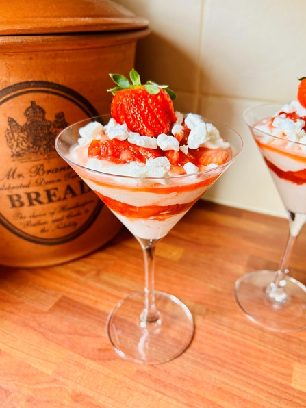 strawberries and cream in a glass