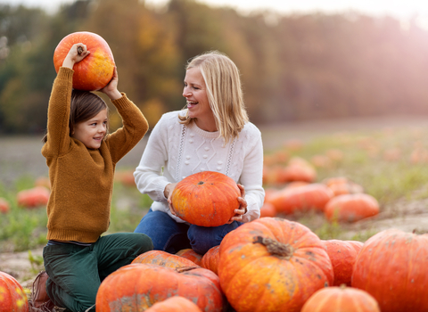 Mother and son in pumkin field
