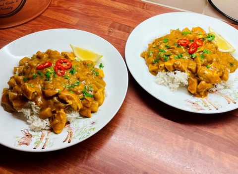 Two plates of turkey curry