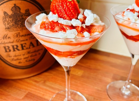 strawberries and cream in a glass