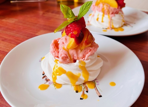 Caramelised Peach and Raspberry Meringues with Homemade Strawberry Ice Cream and Homemade Mango and Passion Fruit Coulis