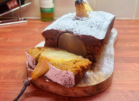 A pear cake on a breadboard